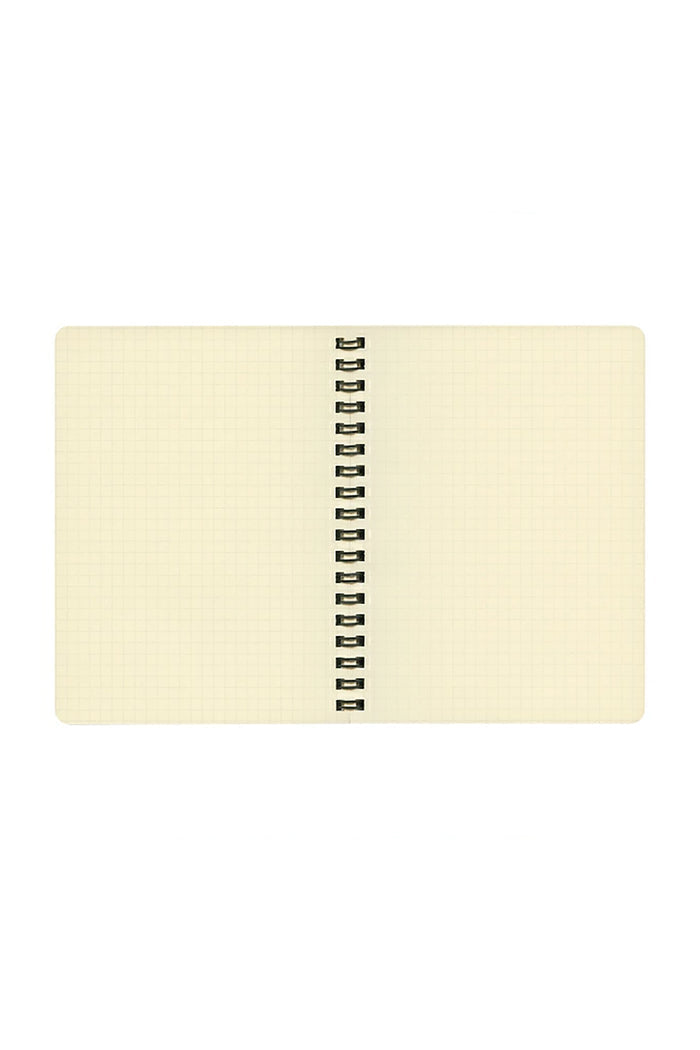 Cream spiral notebook with gold ring binding, lay-flat top view