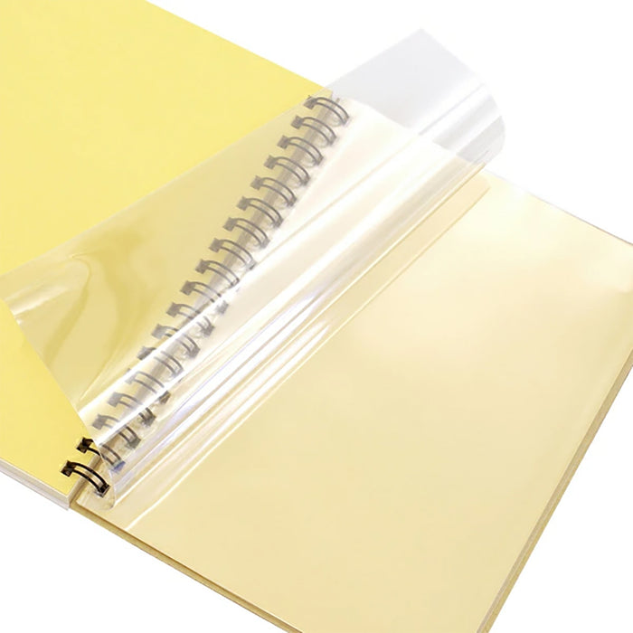 Cream notebook with gold spiral and clear plastic cover