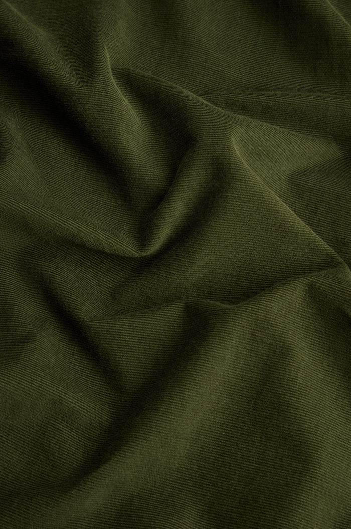 Forest Pinwale Cord Shirt Dress featuring olive green corduroy fabric with visible ridges and soft folds, creating a textured and slightly wrinkled surface—perfect for crafting a stylish and classic look.