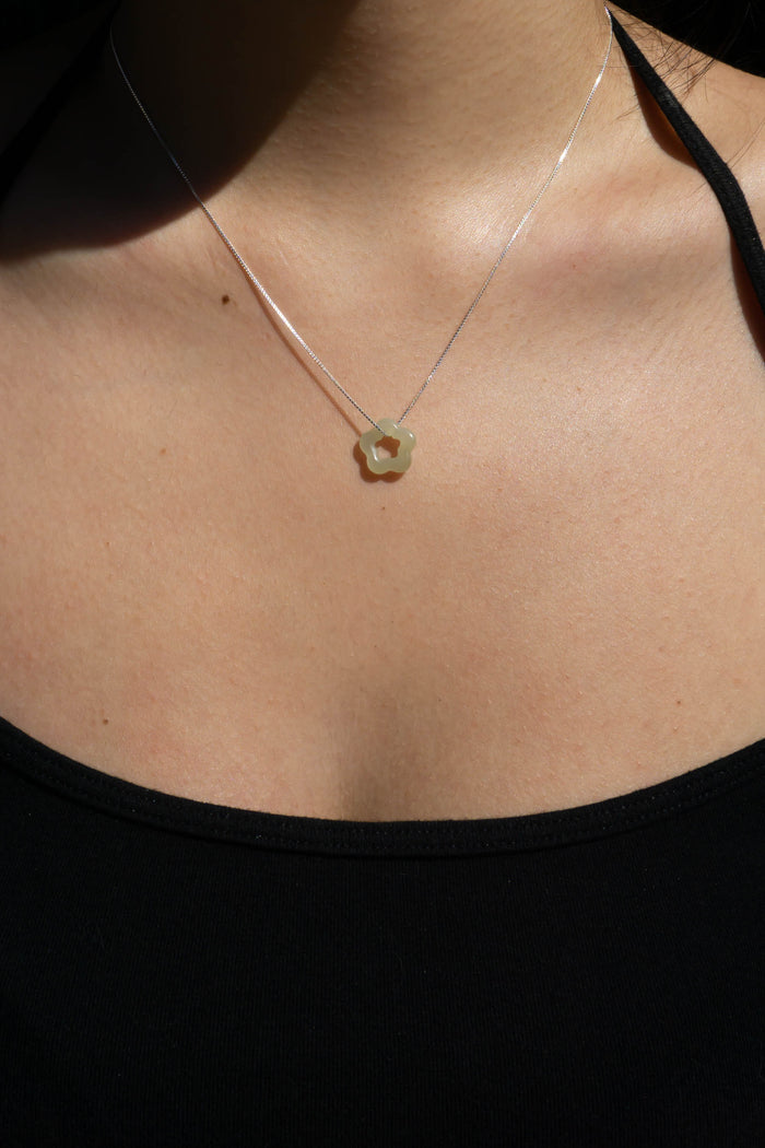 Jade flower sterling silver necklace with small pendant at collarbone