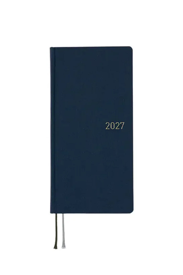 Dark blue 2027 planner with elastic ties and “2027” on cover