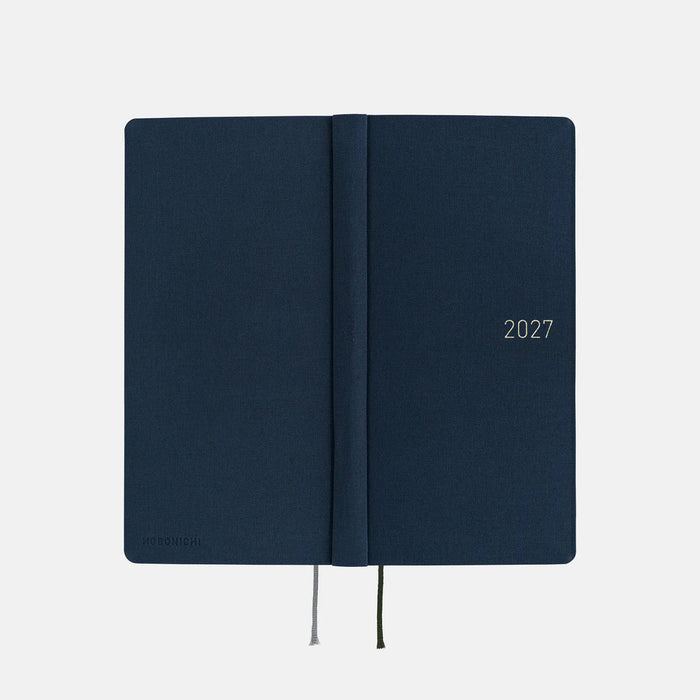 Closed midnight blue 2027 planner with spine seam and elastic ties