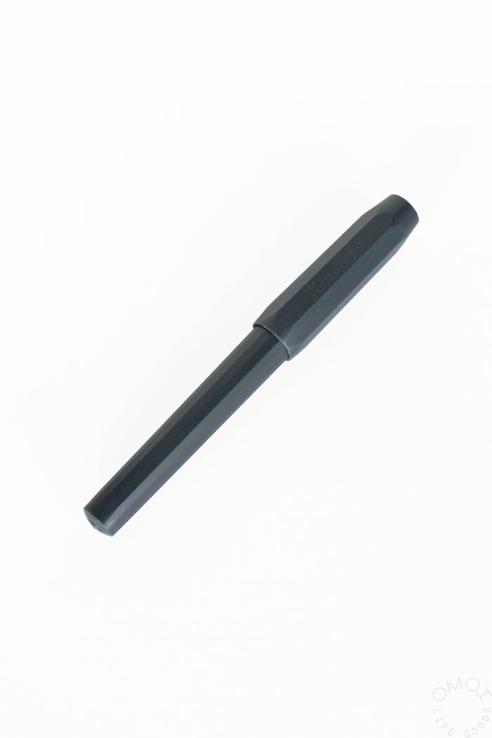 Dark-capped calligraphy fountain pen with slim barrel