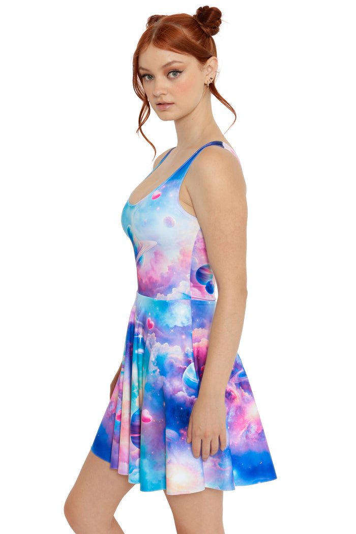 Space-inspired skater dress in blue and pink hues with planetary and starry artwork
