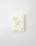 Monthly planner cover in cream with line-art design, text, and MD branding
