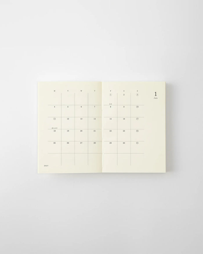 MD 2027 monthly planner notebook open to calendar grid with numbered days