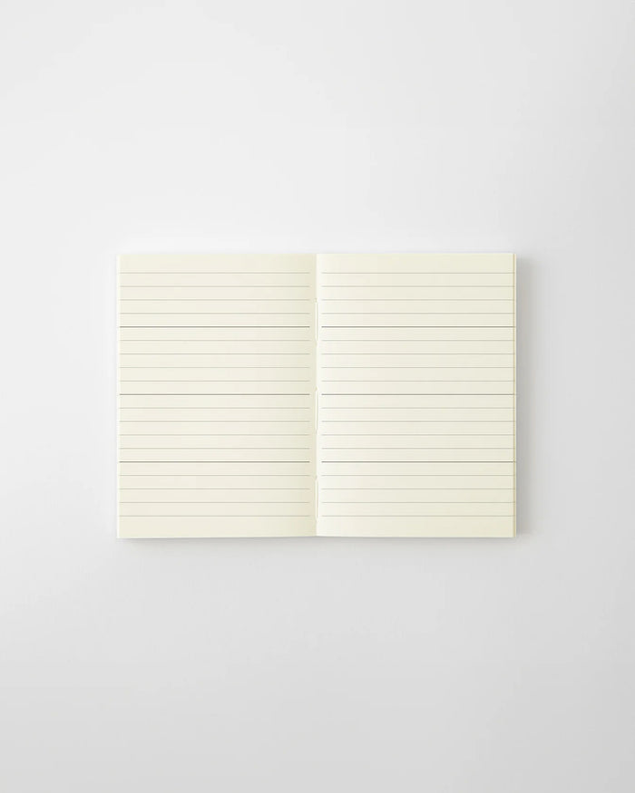 MD 2027 monthly planner notebook open to lined writing pages, two-page spread