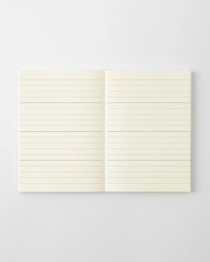 MD 2027 monthly planner notebook open to blank lined pages, two-page spread