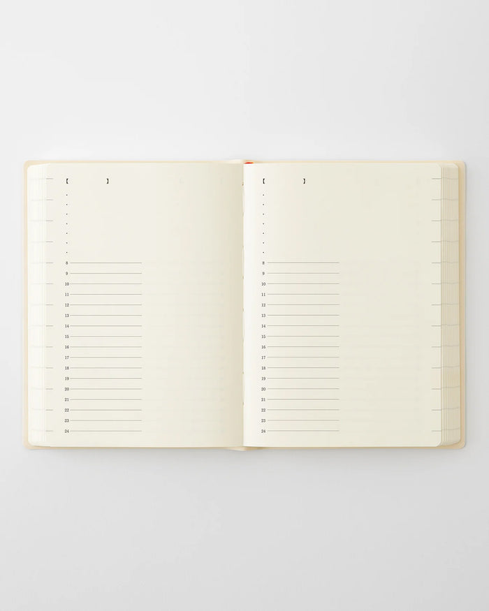 Open page-a-day planner showing ruled monthly grid pages
