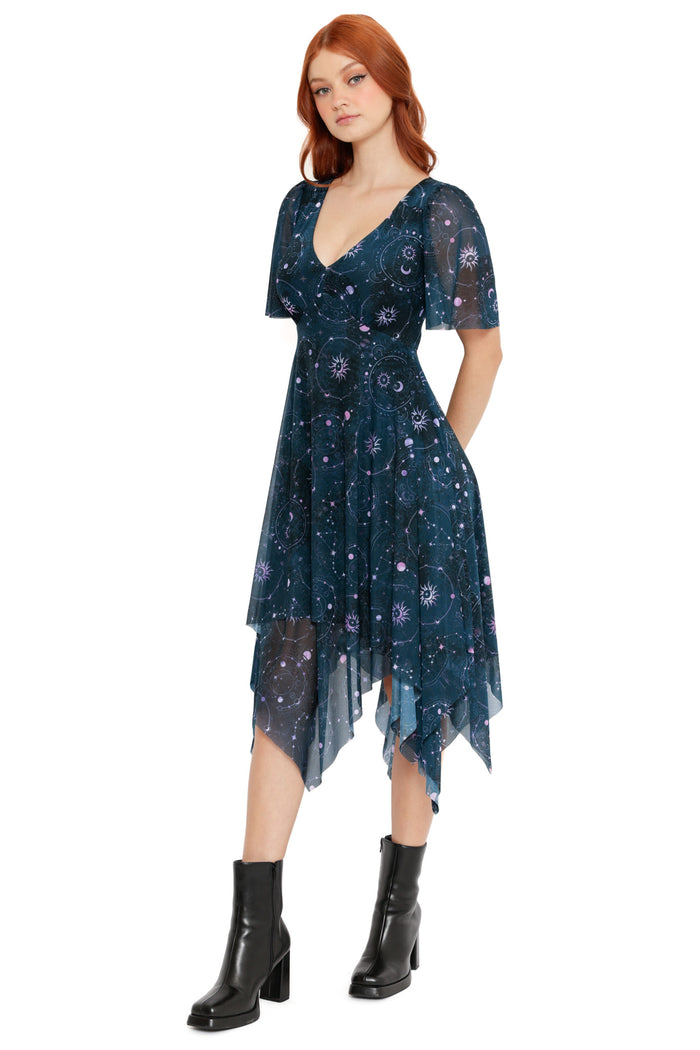 Asymmetric midi dress with sheer overlay featuring celestial sun, moon and star print in deep teal tones