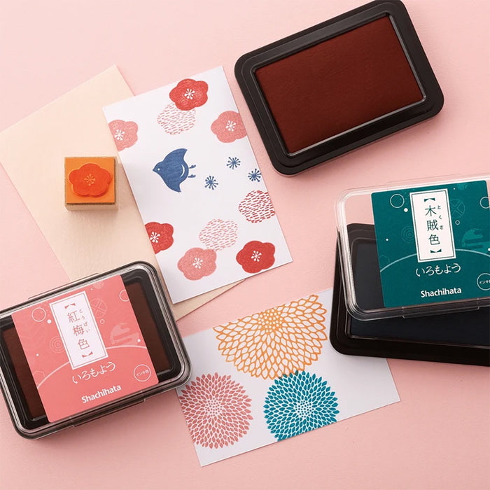 Shachihata large stamp ink pad in dark red, in a black rectangular case