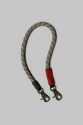 Truffle lattice wrist strap with brass clips and black leather ends