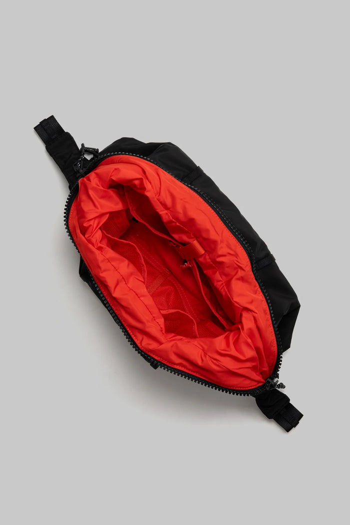 Topologie Cloud Hobo bag small, black exterior with red-lined interior and zipper pull